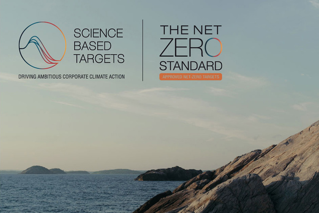 Logos for Science Based Targets and The Net Zero Standard over a coastal landscape with rocky shoreline.