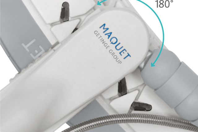 Close-up of a Maquet medical device part showing a 180-degree rotation feature with an arrow indicating direction.